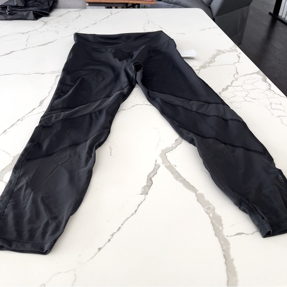 Women’s Leggings from JustFab. Black with Mesh on Lower Legs. NWT.